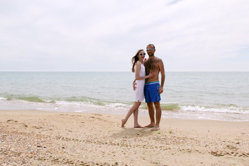 Young couple frolicking on the beach