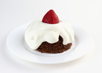 Ketogenic chocolate almond cake with whipped cream and strawberry. Low-Carb, Sugar-Free.