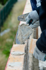 masons working on a construction site close up