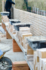 masons working on a construction site close up