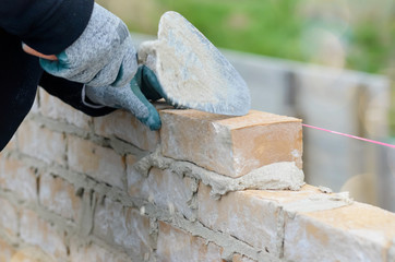masons working on a construction site close up