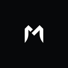 Obraz premium Minimal elegant monogram art logo. Outstanding professional trendy awesome artistic M initial based Alphabet icon logo. Premium Business logo White color on black background