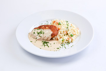 cutlet with rice and vegetables on the white background