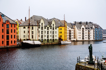 View of center of Alesund, Norway during the winter. Cloudy sky