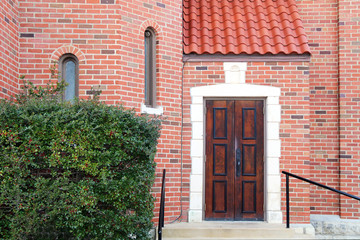 Fototapeta na wymiar red brick manor entrance vintage wood door