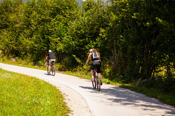 Naklejka premium Mountain Bike cyclists riding countryside track