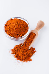 aromatic spicy chili powder on a white background