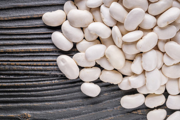 Fresh organic natural beans on wooden rustic background