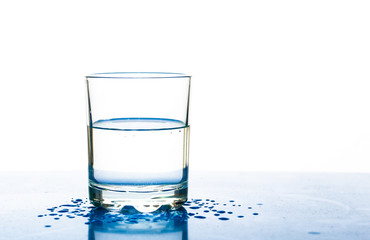 A glass of water on a white background.