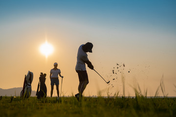 couple lover playing golf together in the course, try to keep golf ball away from the rough to fairway, difficult time stay together in the family concept