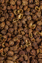 fragrant Sichuan pepper on white acrylic background
