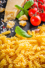 concept of traditional italian pasta with tomatoes and basil