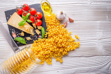 concept of traditional italian pasta with tomatoes and basil