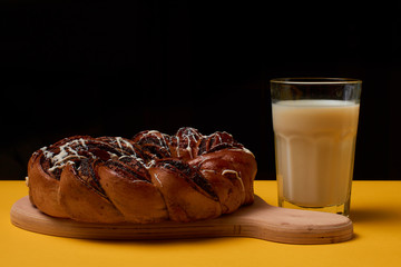 Braided roll with poppy seeds and milk