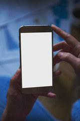 girl holding a smartphone with white copy space - home concept