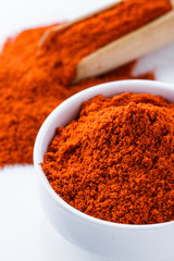 fragrant ground paprika on a white acrylic background