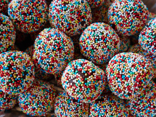 Fototapeta na wymiar Homemade cocoa chocolate balls covered with tiny candies