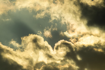 Light in dark stormy rain clouds
