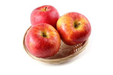 Apples on wicker plate