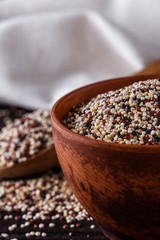mix of quinoa grains on dark wooden rustic background