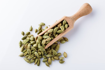 fragrant green cardamom on a white acrylic background