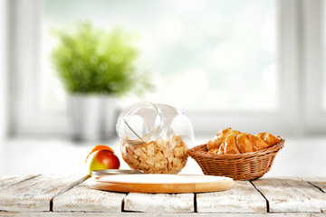 Desk of free space for your decoration and blurred window in kitchen.