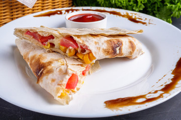 pita meat roll with chicken meat tomato cheese and corn