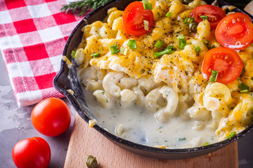 delicious pasta and cheese casserole in a cast iron skillet