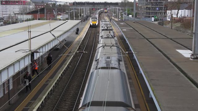 4K. Elevated view of Trains at Luton Station in exterior and cloudy day. Railway station in the Luton of London. Transport concept. Without pandemic.