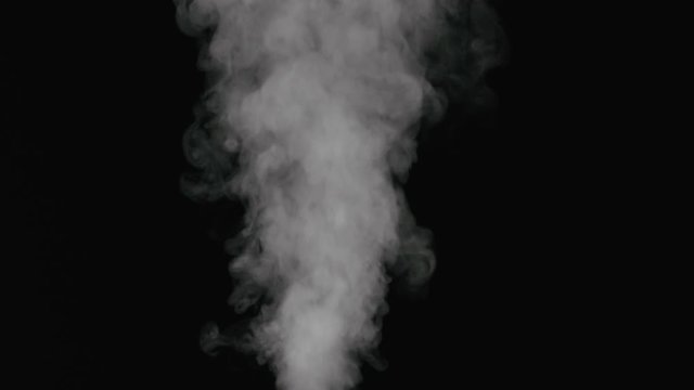 Slow motion water mist puff stream over black background