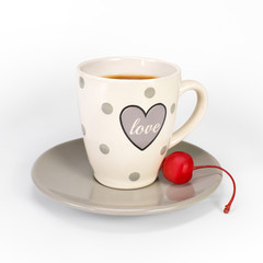 Cup of tea with a cherry on a saucer and with the inscription 