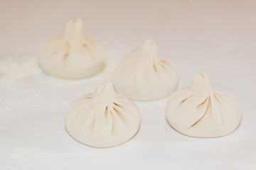 Homemade traditional manti. White background. Close-up.