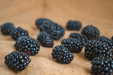 Colorful fruit pattern of blackberries on natural background. Top view. Flat lay