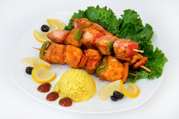 Chicken skewers with vegetables, herbs and rice