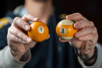 Billiards balls and cue on billiards table. Billiard sport concept