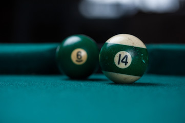 Billiards balls and cue on billiards table. Billiard sport concept