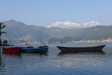 People moving on a canoe in the lake of Pokhara on Nepal