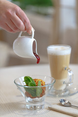 Appetizing gourmet dish fried ice cream dessert on the table in a restaurant in the style of Provence