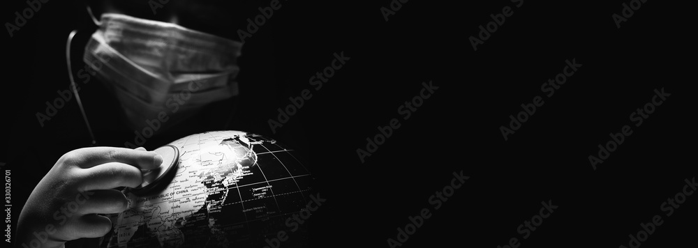 Wall mural kid hold globe put stethoscope on sphere, face covered in mask on black horizontal background. ecolo
