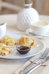 Delicious culinary dishes, desserts, ice cream, waffles and pancakes on the table in the restaurant in the style of Provence