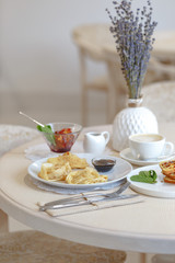 Serving a table in a restaurant in the style of Provence