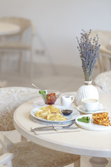 Serving a table in a restaurant in the style of Provence