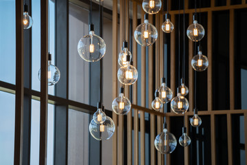 vintage light lamps hanging from ceiling for decoration in living room.