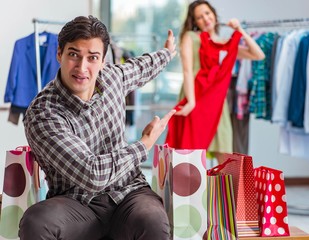 Man waiting for his wife during christmas shopping