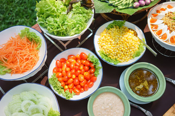 Salads are placed on the table with a notebook and a pen. To record food items or recipes Concept foodie Diet Food Review Weight Loss Diet