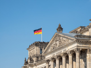 Fototapeta na wymiar Germany flag on Reichstag building in Berlin, Germany
