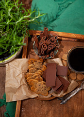 Homemade chocolate chip cookie. Baking, sweet snack. Food on a wooden table. Rustic style. Cooking at home. Chocolate for coffee.