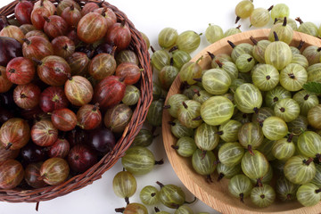 Gooseberrie on plates background. Harvest