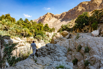 Wadi Shab river canyon, Sultanate of Oman. Natural mountain landscape with green water river and...