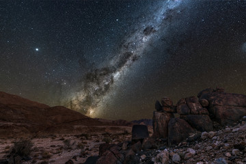 A beautiful night sky landscape with the Milky Way and galactic centre, and interesting rock...
